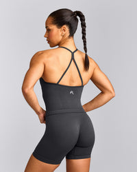 EnhanceLift™ Seamless Strappy Racer Tank Top with Built in Bra Shelf with Gray Logo | Coal