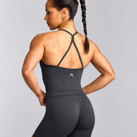 EnhanceLift™ Seamless Strappy Racer Tank Top with Built in Bra Shelf with Gray Logo | Coal