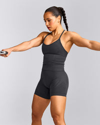 EnhanceLift™ Seamless Strappy Racer Tank Top with Built in Bra Shelf with Gray Logo | Coal