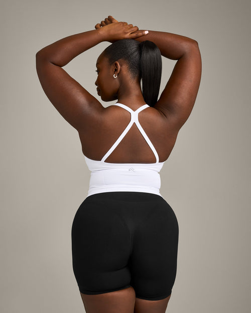 EnhanceLift™ Seamless Strappy Racer Tank Top with Built in Bra Shelf with Gray Logo | White