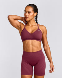 EnhanceLift™ Seamless Strappy Sports Bra with Gray Logo | Burnt Maroon