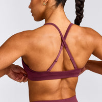 EnhanceLift™ Seamless Strappy Sports Bra with Gray Logo | Burnt Maroon