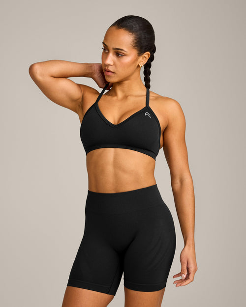 EnhanceLift™ Seamless Strappy Sports Bra with Gray Logo | Black