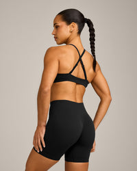 EnhanceLift™ Seamless Strappy Sports Bra with Gray Logo | Black