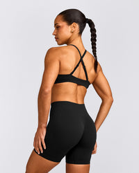 EnhanceLift™ Seamless Strappy Sports Bra with Gray Logo | Black