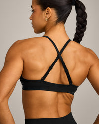 EnhanceLift™ Seamless Strappy Sports Bra with Gray Logo | Black