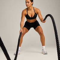 EnhanceLift™ Seamless Strappy Sports Bra with Gray Logo | Black