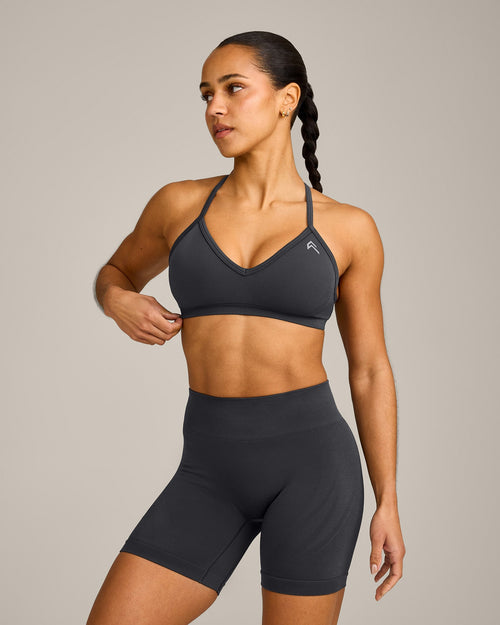 EnhanceLift™ Seamless Strappy Sports Bra with Gray Logo | Coal