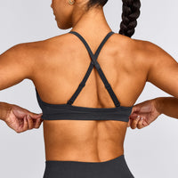 EnhanceLift™ Seamless Strappy Sports Bra with Gray Logo | Coal