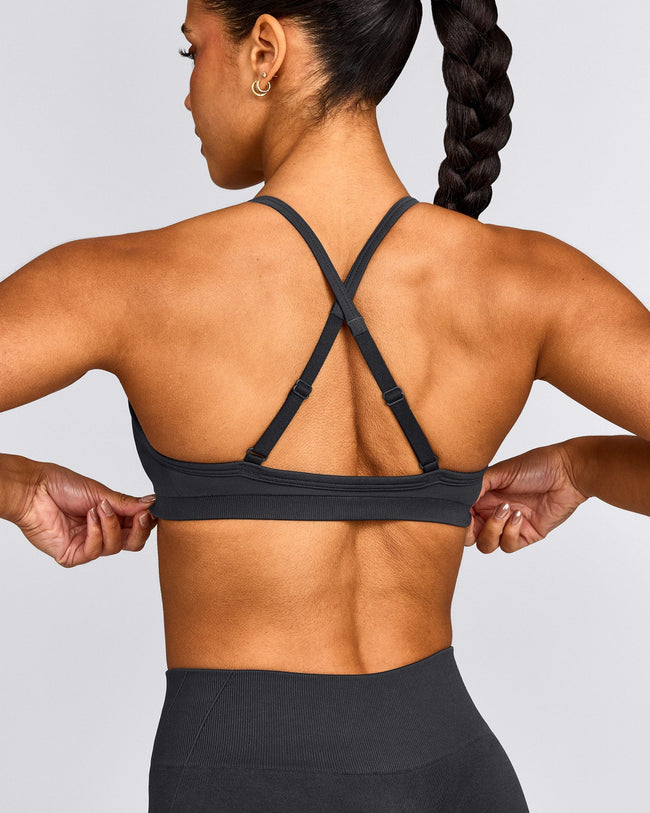 EnhanceLift™ Seamless Strappy Sports Bra with Gray Logo | Coal