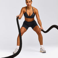 EnhanceLift™ Seamless Strappy Sports Bra with Gray Logo | Coal