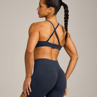 EnhanceLift™ Seamless Strappy Sports Bra with Gray Logo | True Blue