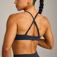 EnhanceLift™ Seamless Strappy Sports Bra with Gray Logo | True Blue