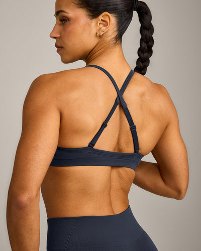 EnhanceLift™ Seamless Strappy Sports Bra with Gray Logo | True Blue