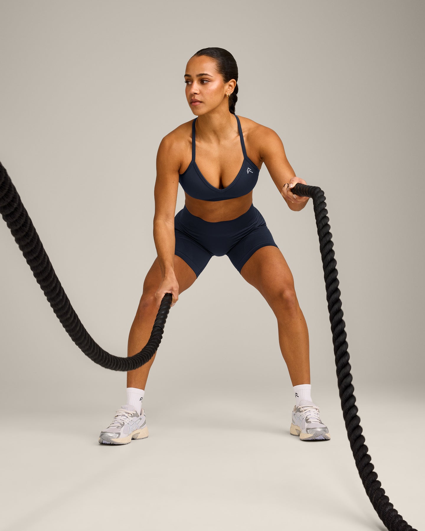EnhanceLift™ Seamless Strappy Sports Bra with Gray Logo | True Blue