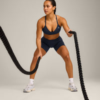 EnhanceLift™ Seamless Strappy Sports Bra with Gray Logo | True Blue