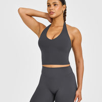 SoftMotion™ Halter Neck Mid Vest with Built in Bra Shelf with White Logo | Coal