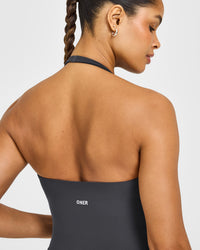 SoftMotion™ Halter Neck Mid Vest with Built in Bra Shelf with White Logo | Coal
