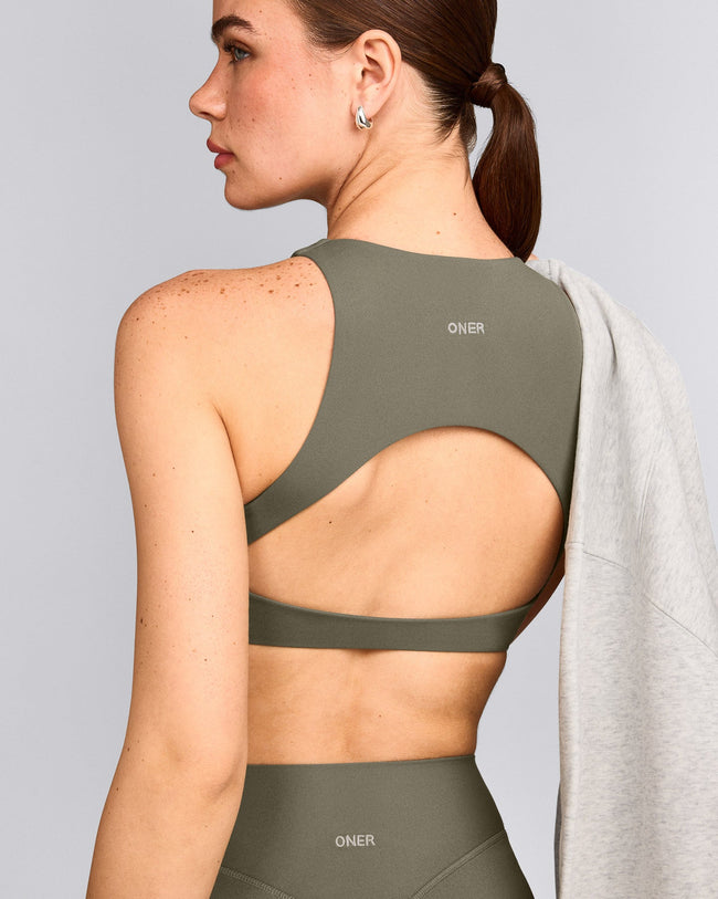 SoftMotion™ High Neck Sports Bra with Gray Logo | Alpine Green