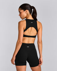 SoftMotion™ High Neck Sports Bra with Gray Logo | Black