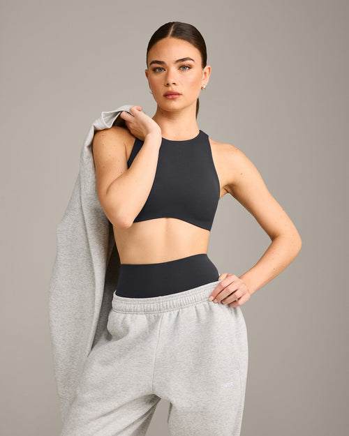 SoftMotion™ High Neck Sports Bra with Gray Logo | Coal