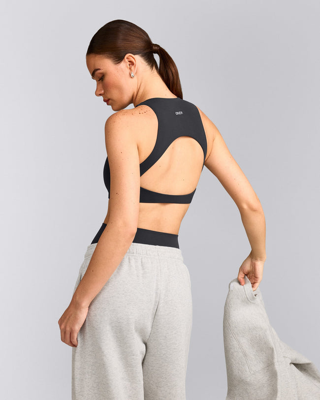 SoftMotion™ High Neck Sports Bra with Gray Logo | Coal