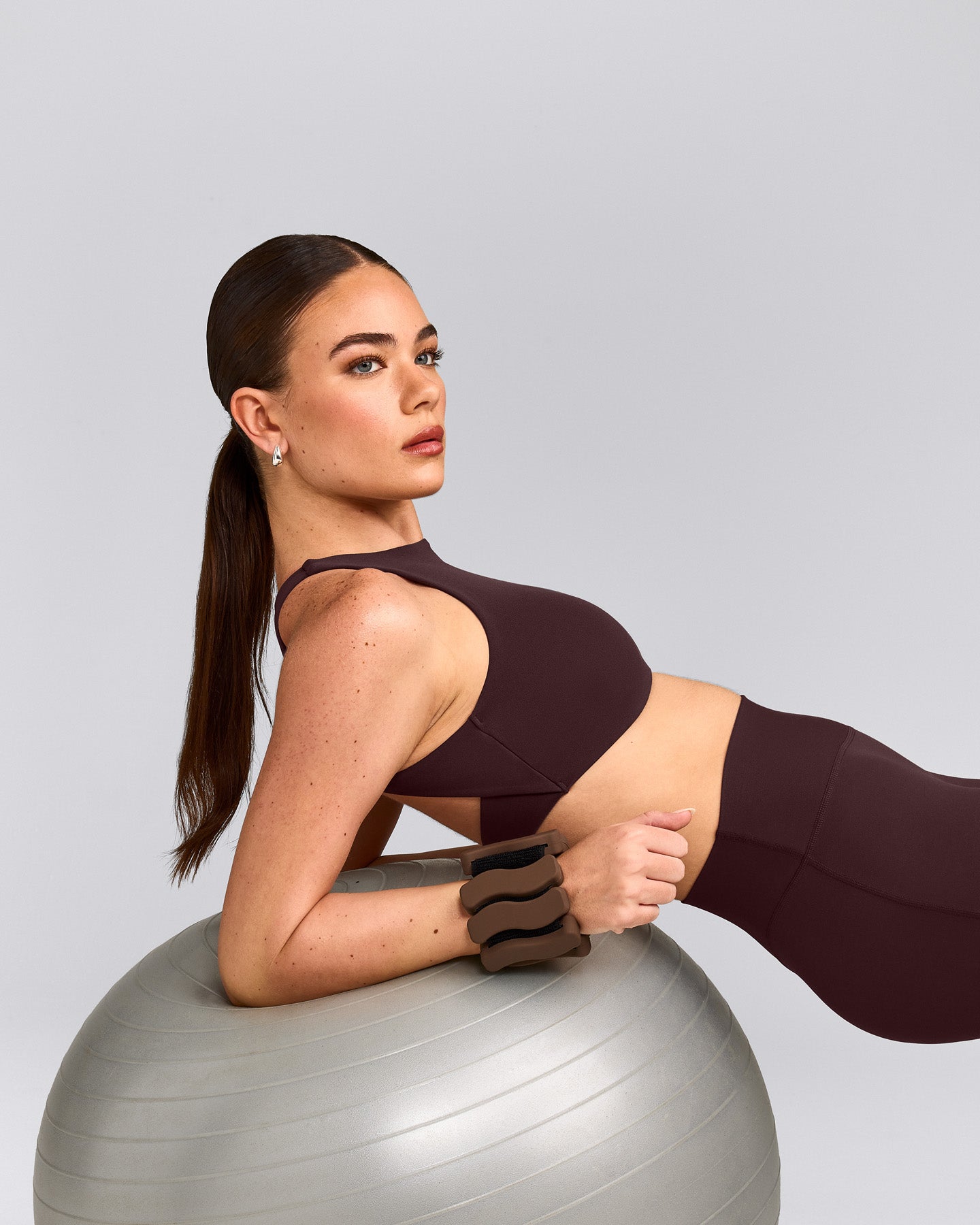 SoftMotion™ High Neck Sports Bra with Gray Logo | Plum Brown