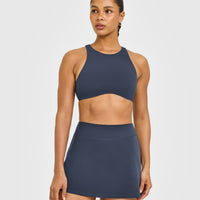 SoftMotion™ High Neck Sports Bra with White Logo | True Blue