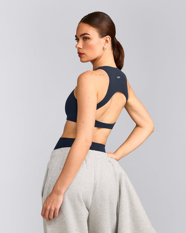 SoftMotion™ High Neck Sports Bra with Gray Logo | True Blue