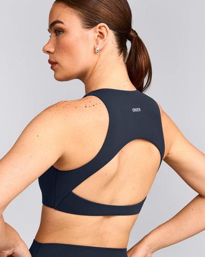 SoftMotion™ High Neck Sports Bra with Gray Logo | True Blue