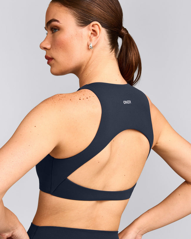 SoftMotion™ High Neck Sports Bra with Gray Logo | True Blue