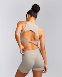 SoftMotion™ High Neck Sports Bra with White Logo | Warm Sand