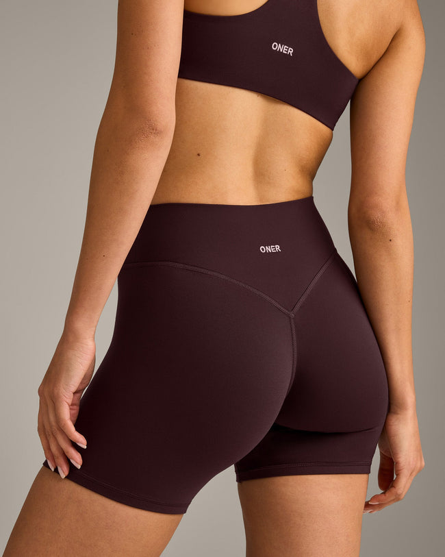 SoftMotion™ High Waisted Shorts 6" with Gray Logo | Plum Brown