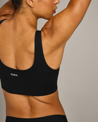 SoftMotion™ Longline Sports Bra with Gray Logo | Black