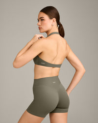 SoftMotion™ Minimal Halter Neck Bralette with Gray Logo | Alpine Green