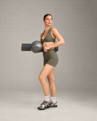 SoftMotion™ Minimal Halter Neck Bralette with Gray Logo | Alpine Green