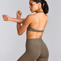 SoftMotion™ Minimal Halter Neck Bralette with Gray Logo | Moss Brown