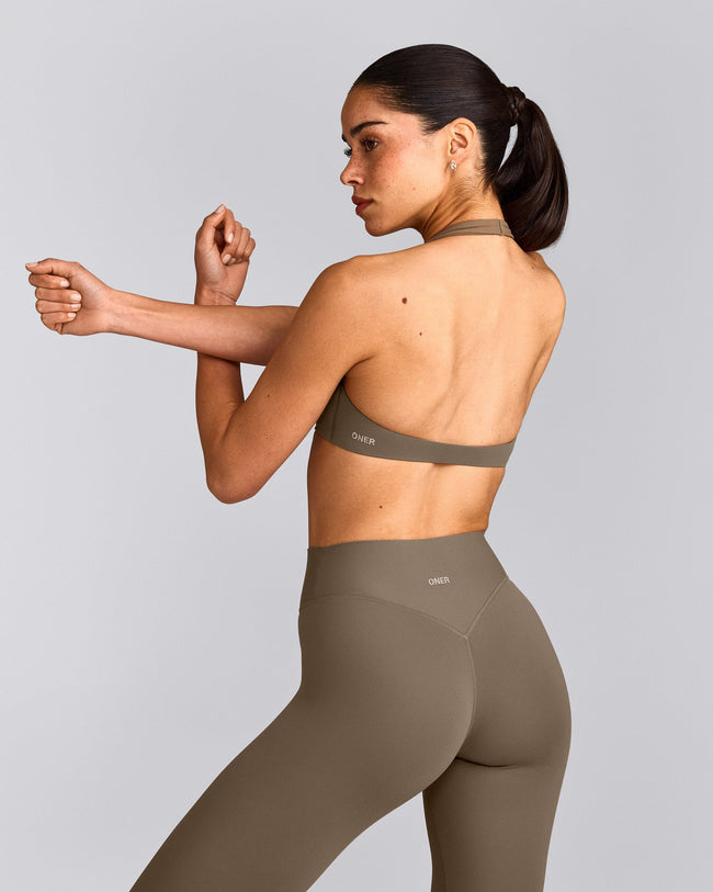 SoftMotion™ Minimal Halter Neck Bralette with Gray Logo | Moss Brown