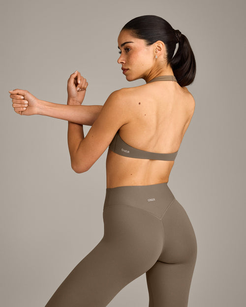 SoftMotion™ Minimal Halter Neck Bralette with Gray Logo | Moss Brown