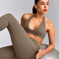 SoftMotion™ Minimal Halter Neck Bralette with Gray Logo | Moss Brown