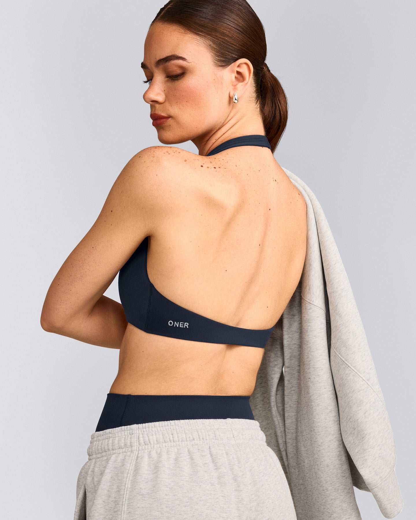 SoftMotion™ Minimal Halter Neck Bralette with Gray Logo | True Blue