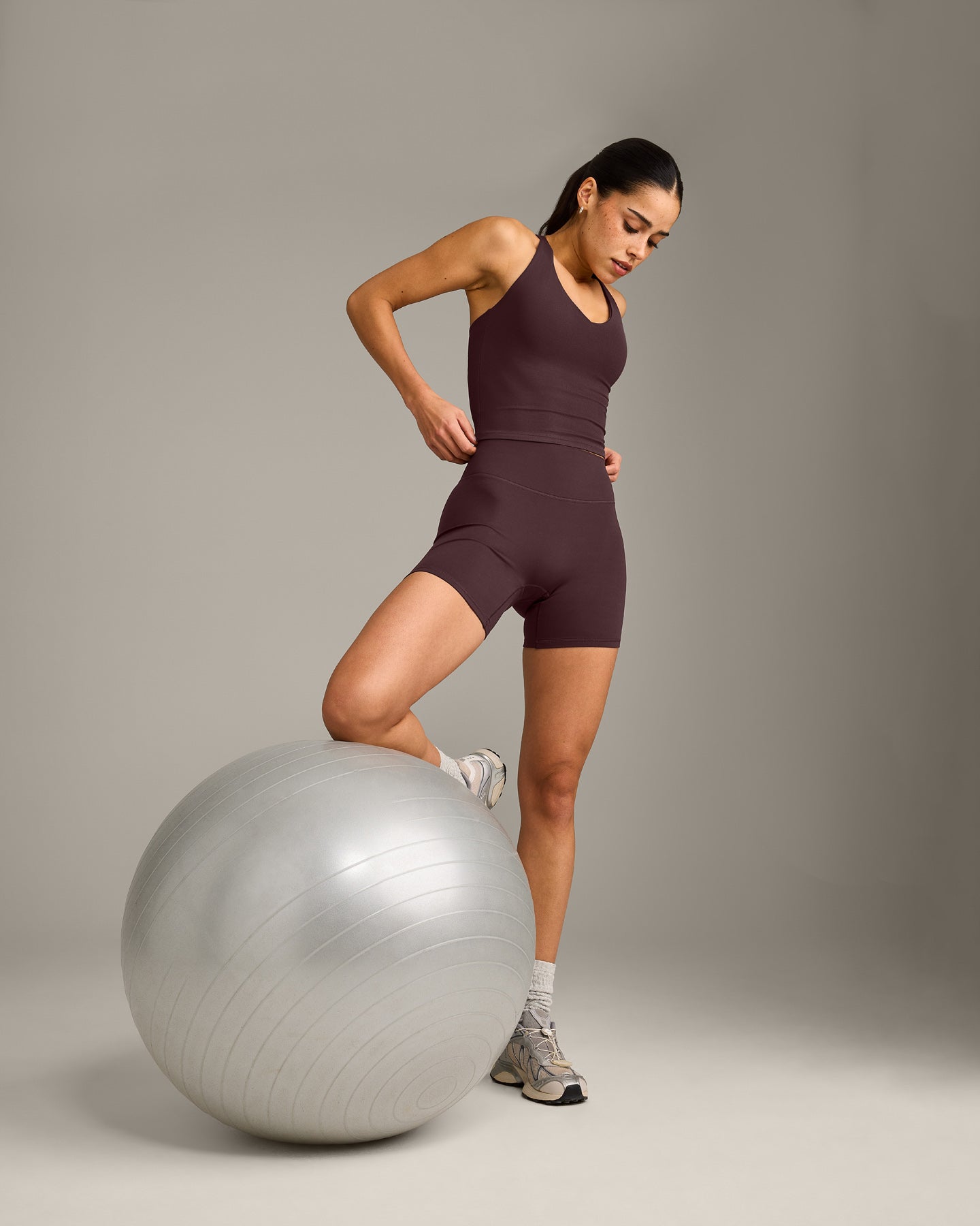 SoftMotion™ Racer Back Mid Vest with Built in Bra Shelf with Gray Logo | Plum Brown