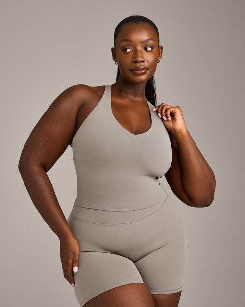 SoftMotion™ Racer Back Mid Tank Top with Built in Bra Shelf with White Logo | Warm Sand