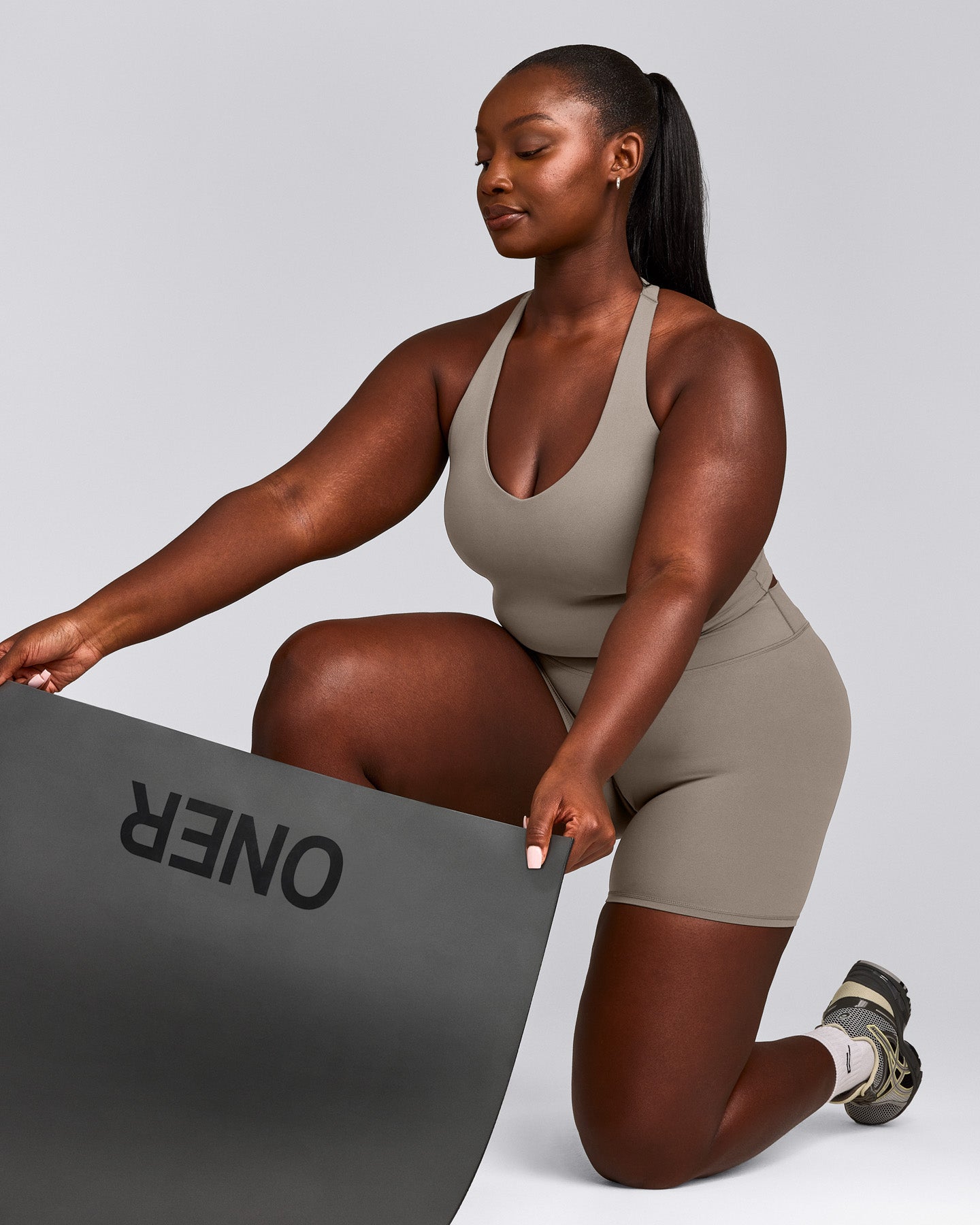 SoftMotion™ Racer Back Mid Tank Top with Built in Bra Shelf with White Logo | Warm Sand