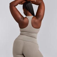 SoftMotion™ Racer Back Tank Top with Built in Bra Shelf with White Logo | Warm Sand