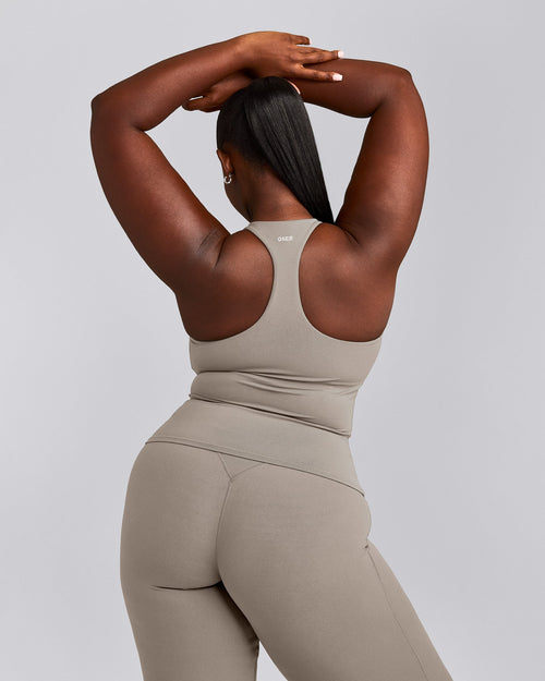 SoftMotion™ Racer Back Tank Top with Built in Bra Shelf with White Logo | Warm Sand