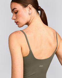 SoftMotion™ Strappy Tank Top with Built in Bra Shelf with Gray Logo | Alpine Green