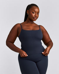 SoftMotion™ Strappy Mid Tank Top with Built in Bra Shelf with Gray Logo | True Blue