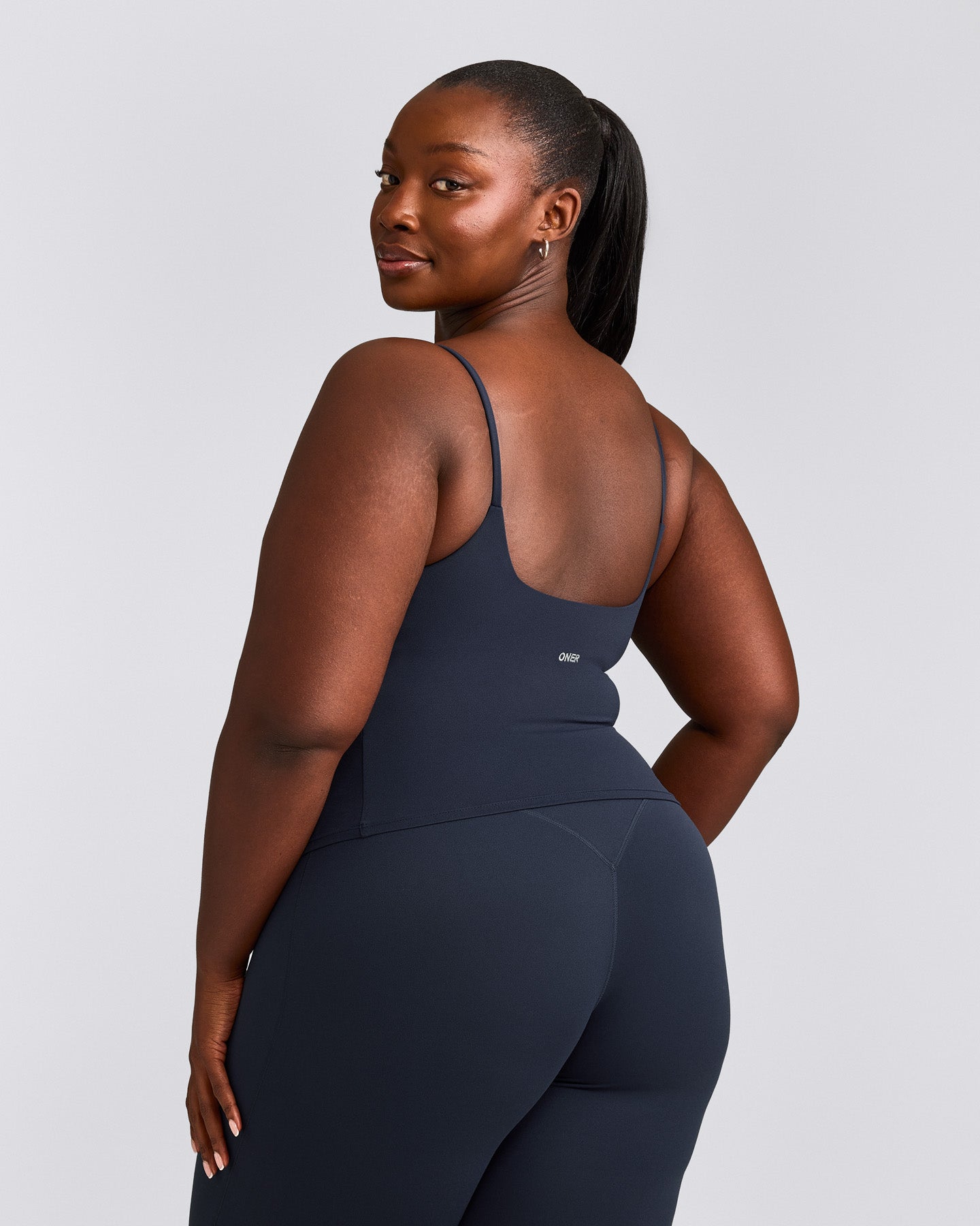 SoftMotion™ Strappy Mid Tank Top with Built in Bra Shelf with Gray Logo | True Blue