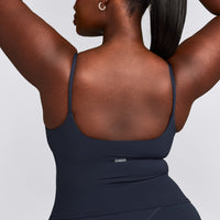 SoftMotion™ Strappy Mid Tank Top with Built in Bra Shelf with Gray Logo | True Blue